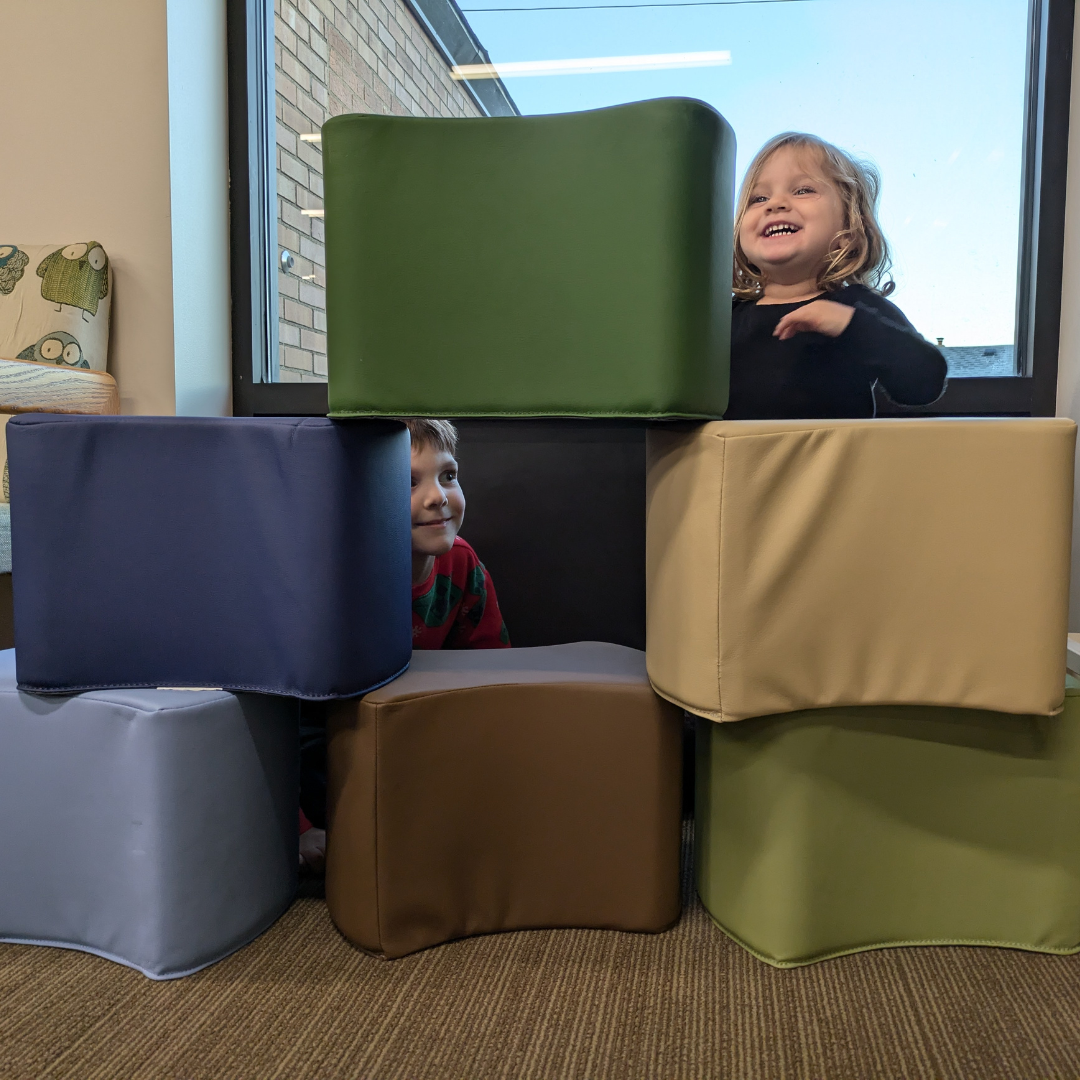 Image of two young children building a block fort at the Elwood Branch