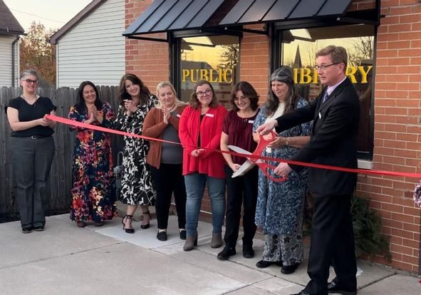 Image of the board of trustees cutting the ribbon on the Elwood Branch on November 19, 2024.